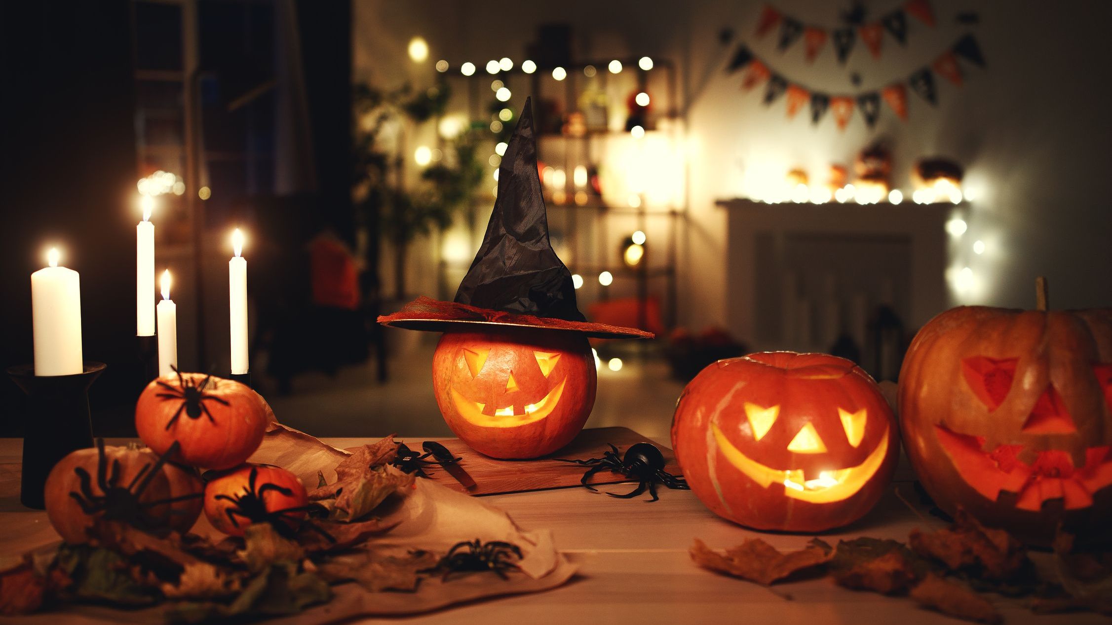 Dark interior of house decorated for Halloween pumpkins, webs and spiders