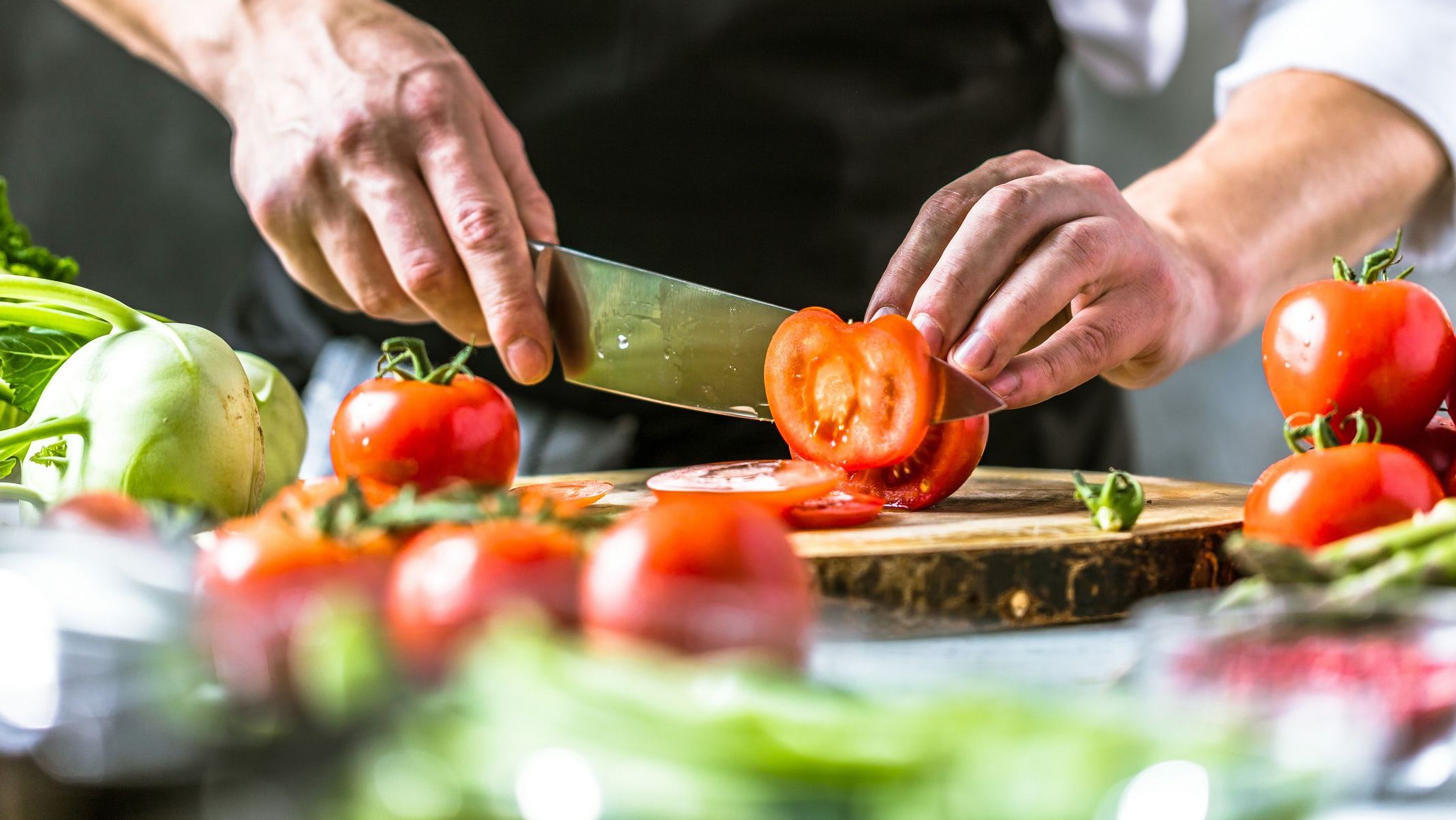 Chef cook preparing vegetables in his kitchen