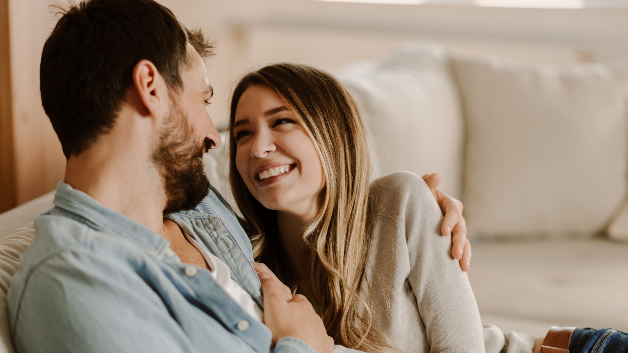 Loving happy couple talking to each other at home