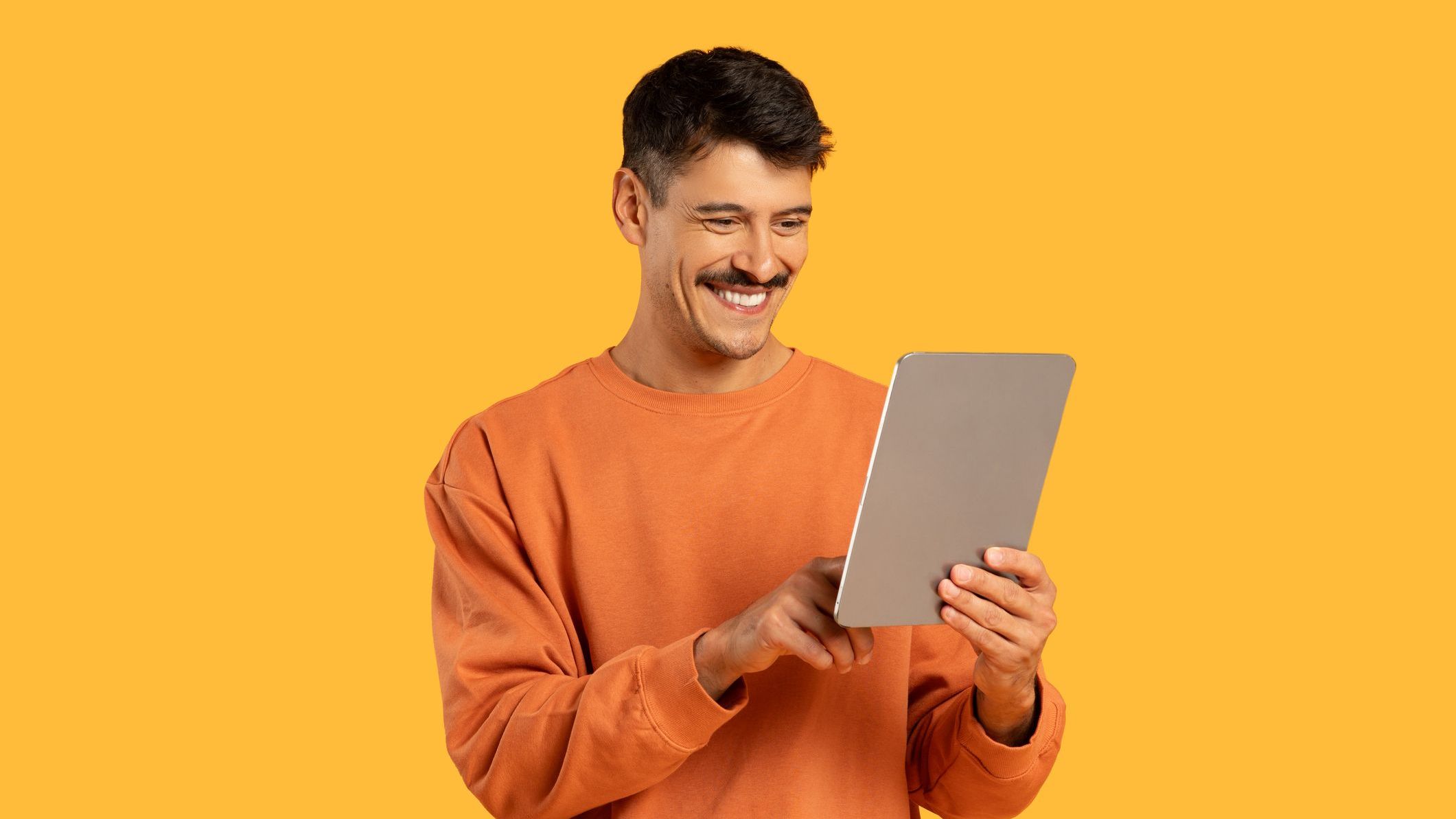 Man with a tablet and happy expression