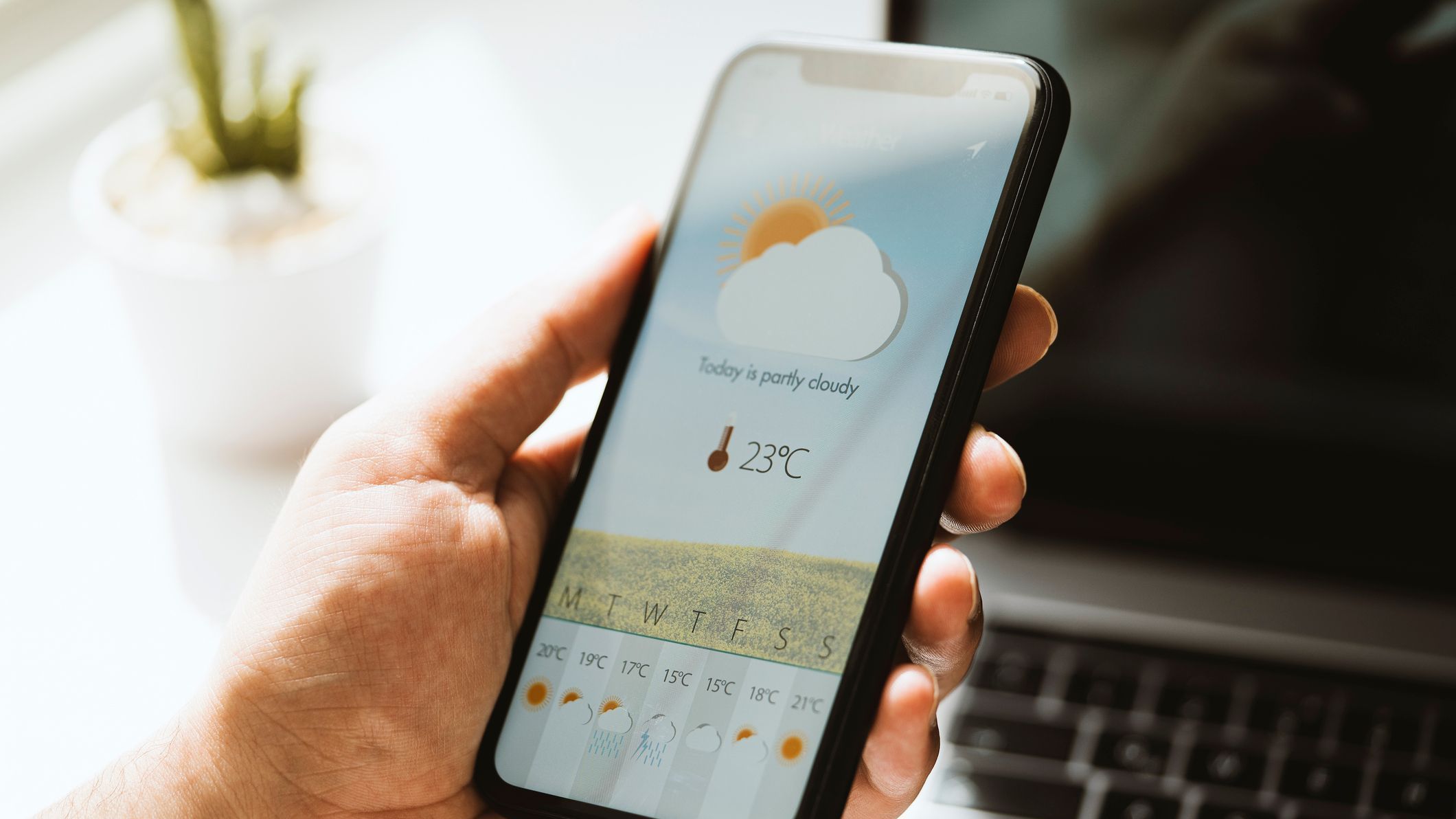 Weather forecast app on mobile phone screen
