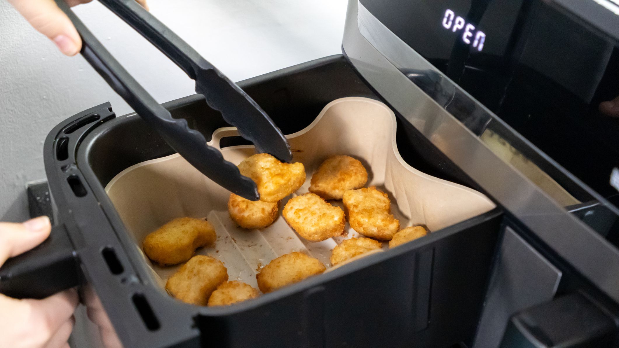 Nuggets cooked in an air fryer. Cooking in an air fryer.